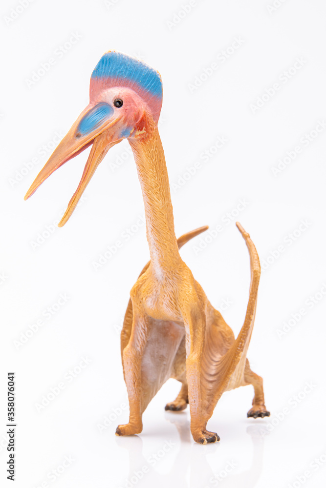 Fototapeta premium close-up of a plastic pterodactyl colorfull figurine isolated on a white background