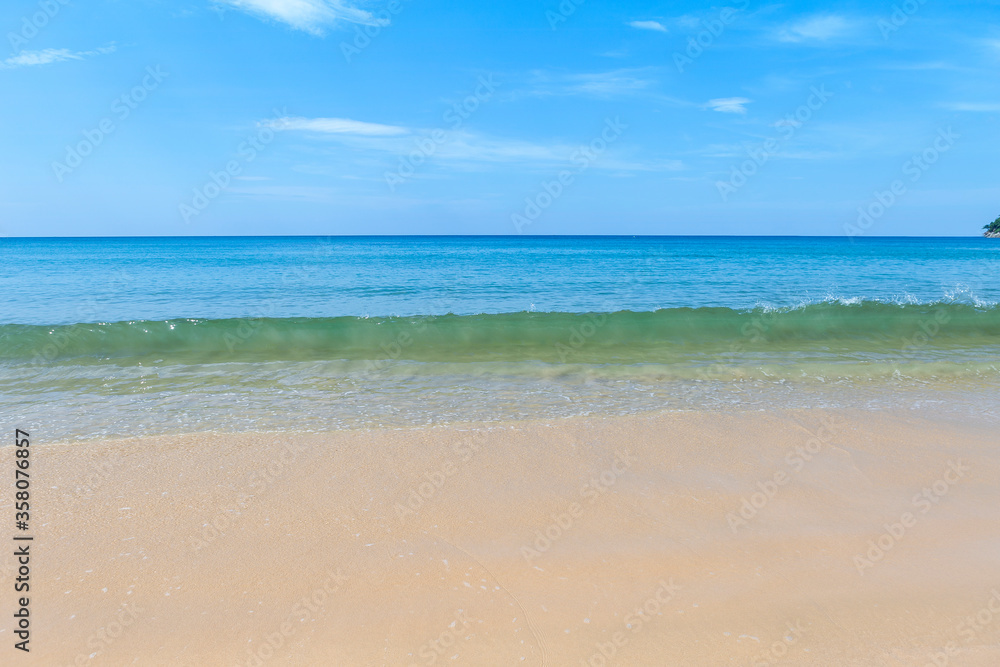 Clean sea water wave on empty sand beach, nature and environmental concept background, tropical island in south of Thailand Clean sea water wave on empty sand beach, nature and environmental concept background, tropical island in south of Thailand