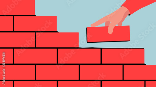 Vector illustration of unfinished brick wall. Bright illustration of a red brick wall construction with a hand putting a brick along with the rest.