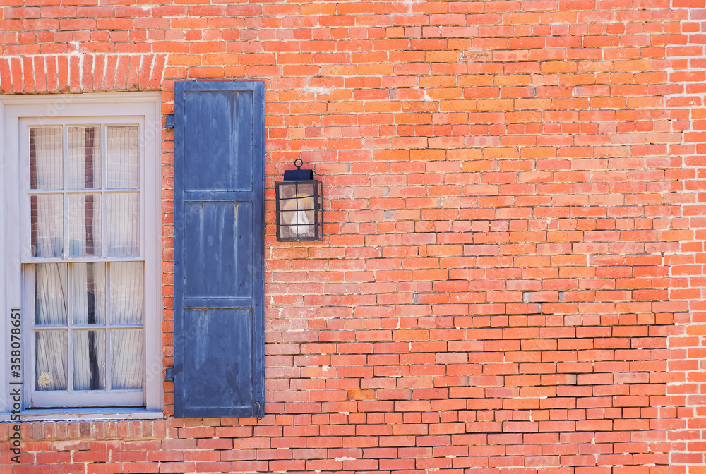 Old brick wall with blue window