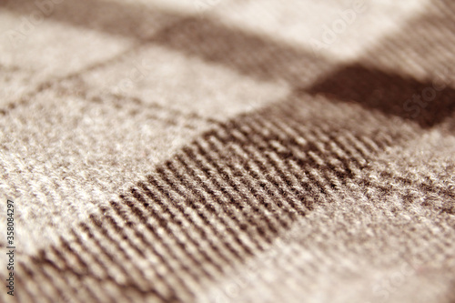 sample of thick checked and striped fabric  fabric texture  close-up  copy space  macro photo