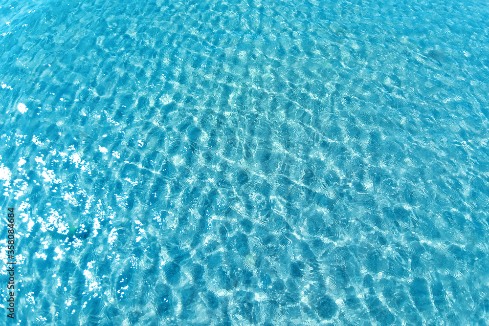 Obraz premium Background shot of aqua water surface. Swimming pool with sunny reflections.