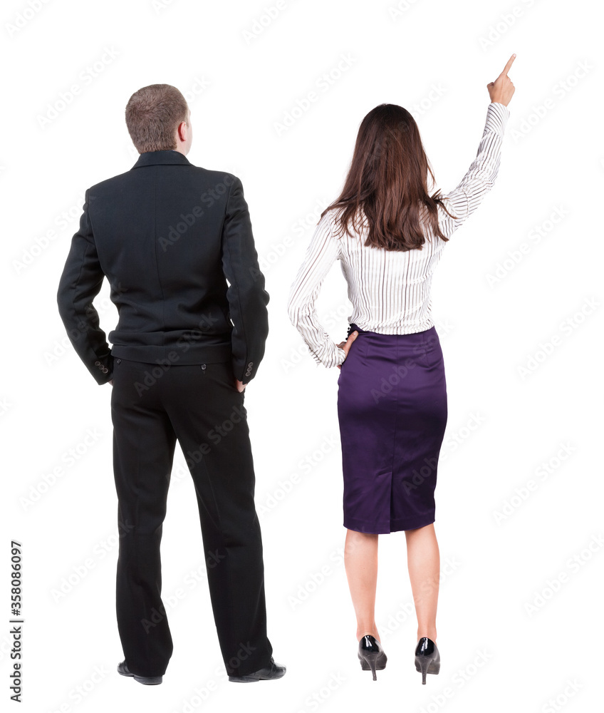 Back view of business man and business woman in suit pointing. Back view of business man and business woman in suit pointing.
