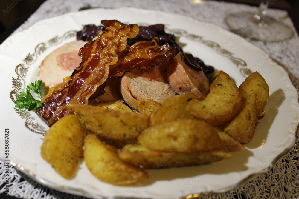 filet mignon stuffed with pork and baked potatoes with fried bacon filet mignon stuffed with pork and baked potatoes with fried bacon