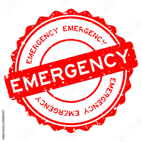 Grunge red emegency word round rubber seal stamp on white background