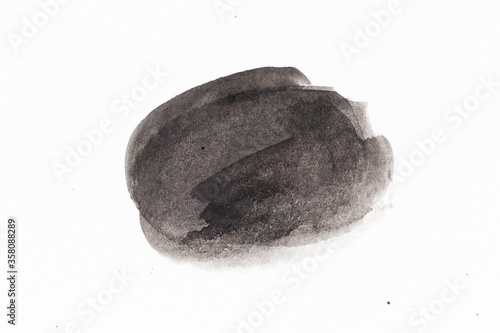 Black color watercolor handdrawing as round brush or banner on white paper background © bankrx