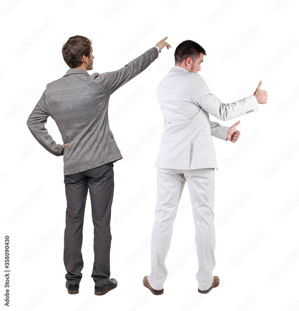 Back view of two business men in suit pointing. Back view of two business men in suit pointing.