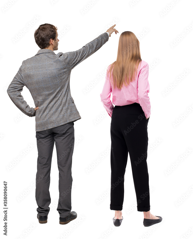 Back view of business man and business woman in suit pointing. Back view of business man and business woman in suit pointing.