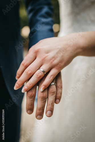 Bride and groom showing off their beautiful wedding rings