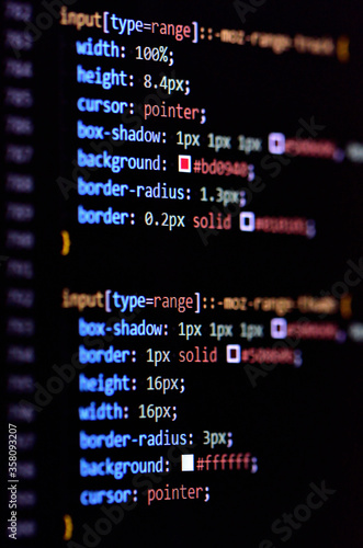 Close-up of modern CSS3 cascade style sheet programming code for HTML coding. Vertical photo. © cobracz
