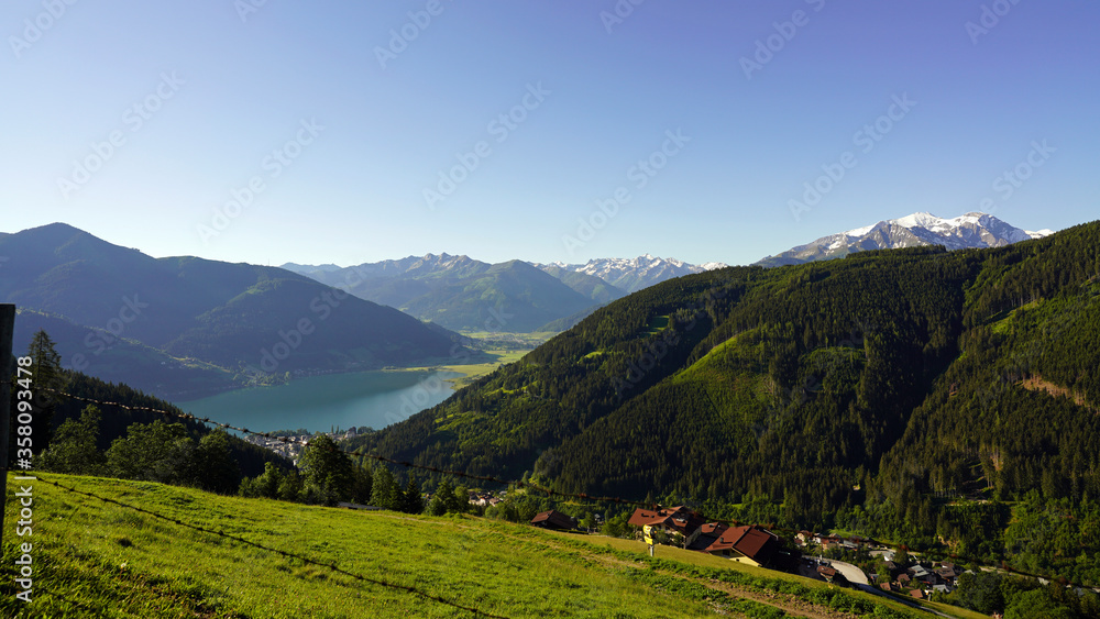 beautiful view to the lake from zell am see on a sunny day with blue clear sky and view to the alps