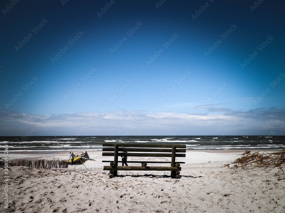 Bench on beach in Stilo, Baltic Sea coast, Poland.