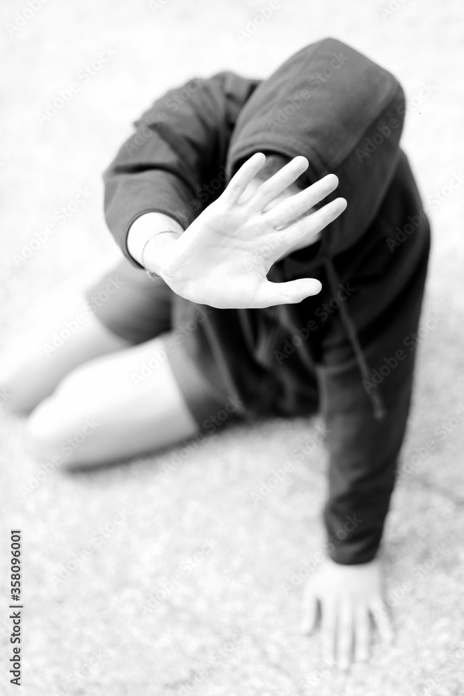 Hand of Boy trying to protect himself from his attacker with whi Hand of Boy trying to protect himself from his attacker with whi