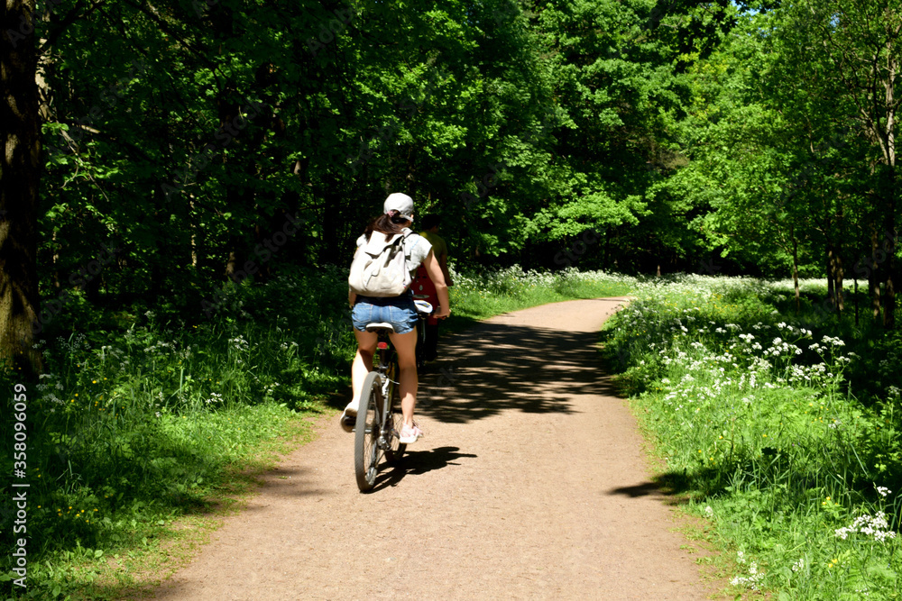 a girl rides a Bicycle