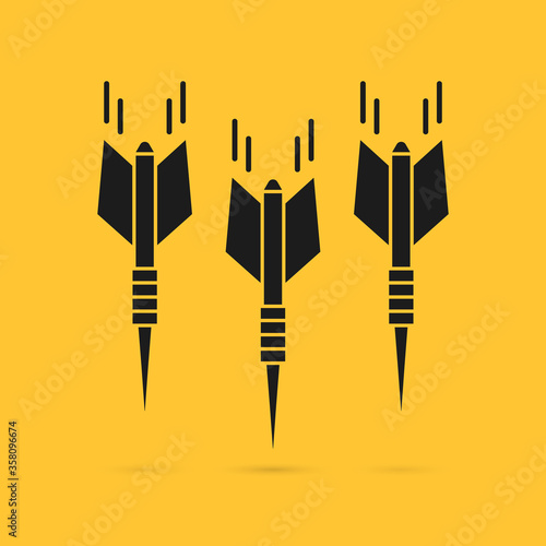 black darts falling down with shadow
