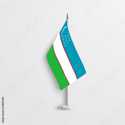 Uzbekistan table flag on light grey background. Uzbekistan desk flag isolated on grey background.