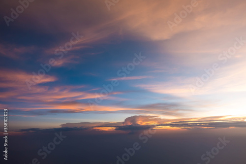 Sunset sky during twilight from airplane window
