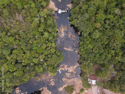 Beautiful drone aerial view over Curua River waterfalls and forest trees in the Serra do Cachimbo in the Amazon rainforest, Para, Brazil. Concept of ecology, environment, conservation, nature, co2.