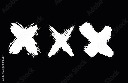 Set of crosses in grunge style. Paint strokes with a dry brush