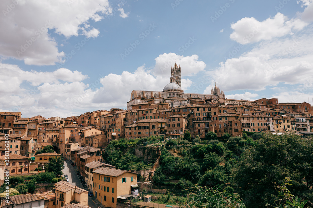 Panoramic view of Siena city with historic buildings and street