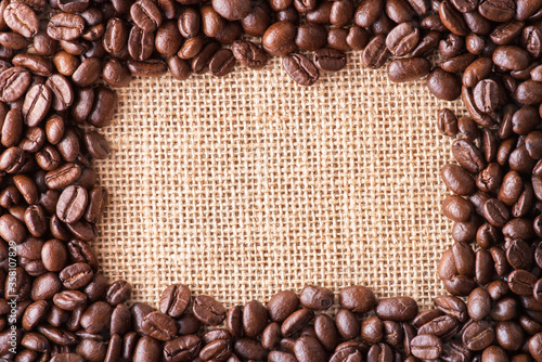 Coffee beans on bag background with copy space