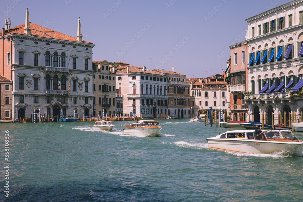 Panoramic view of Grand Canal (Canal Grande) with active traffic boats