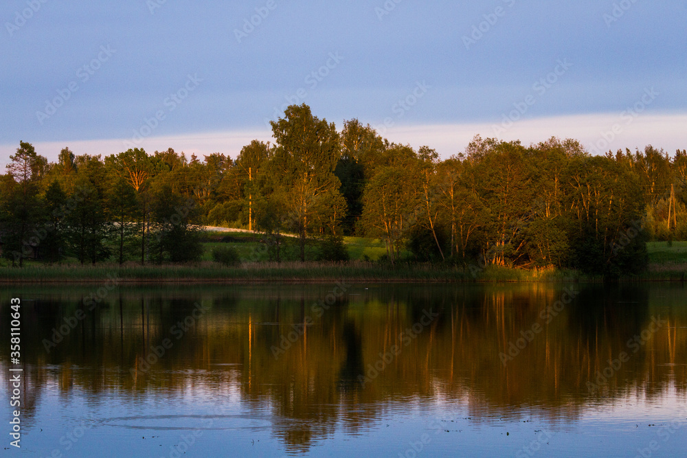 lake shore with  fog at sunset