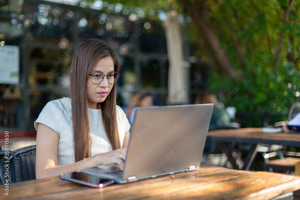 Asian woman using computer laptop work from home concept. Asian woman using computer laptop work from home concept.