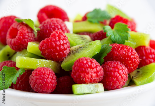 Fresh fruit salad with with raspberry and kiwi