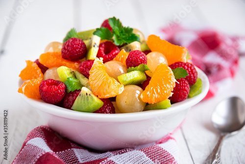 Fresh fruit salad with with raspberry  mandarin and other fruit