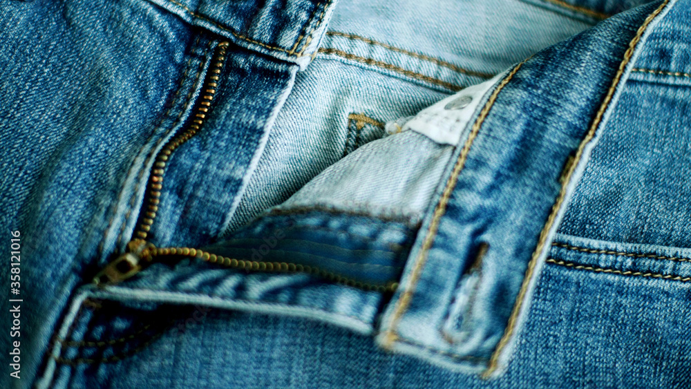 Jeans denim texture close up , focus only one point , soft blured background wallpaper