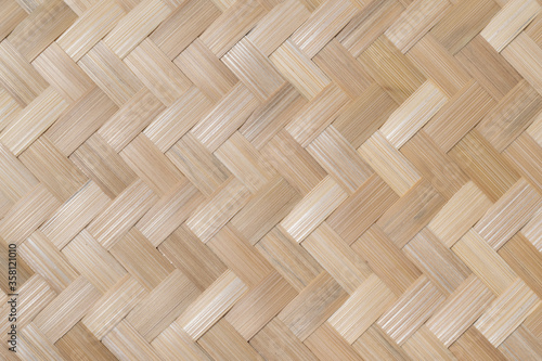Texture details of bamboo weave for background. Vertical zigzag pattern of Thai wickerwork for furniture made from natural materials.
