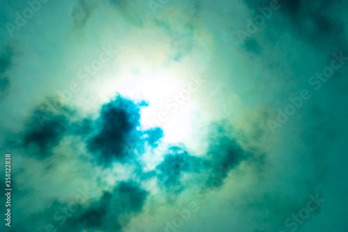 Colored image of a clouded sun