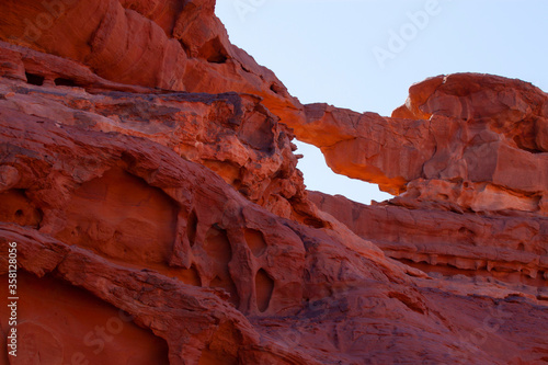 red rock formation and a stone arch