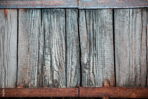 texture of a wooden array on a frame of a metal corner