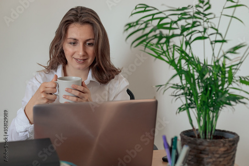 Happy young girl student watch webinar listen online course communicate by conference video call