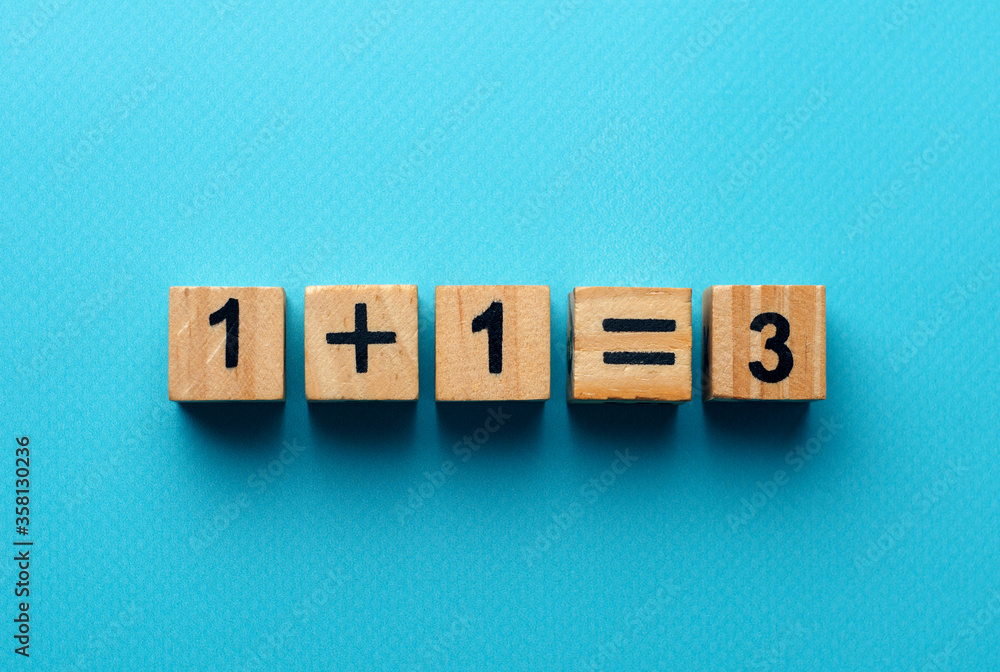 wooden cubes with the numbers 2 and 1 on a blue background. take two third goods as a gift. three for the price of two wooden cubes with the numbers 2 and 1 on a blue background. take two third goods as a gift. three for the price of two