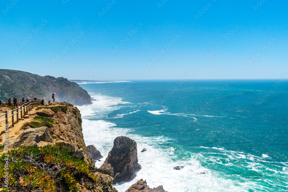 Cabo da Roca, the most western point in Europe. Ocean and the horizon on the sea. Clear turquoise ocean water, view from the cliff.