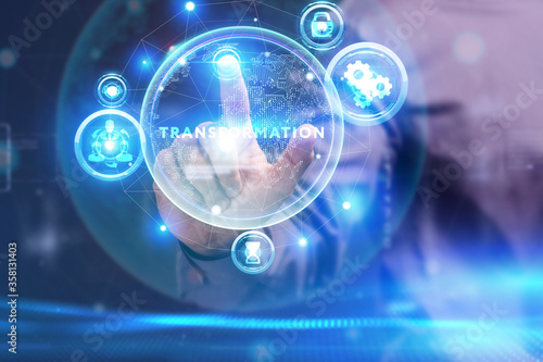 Business, Technology, Internet and network concept. Young businessman working on a virtual screen of the future and sees the inscription: Transformation