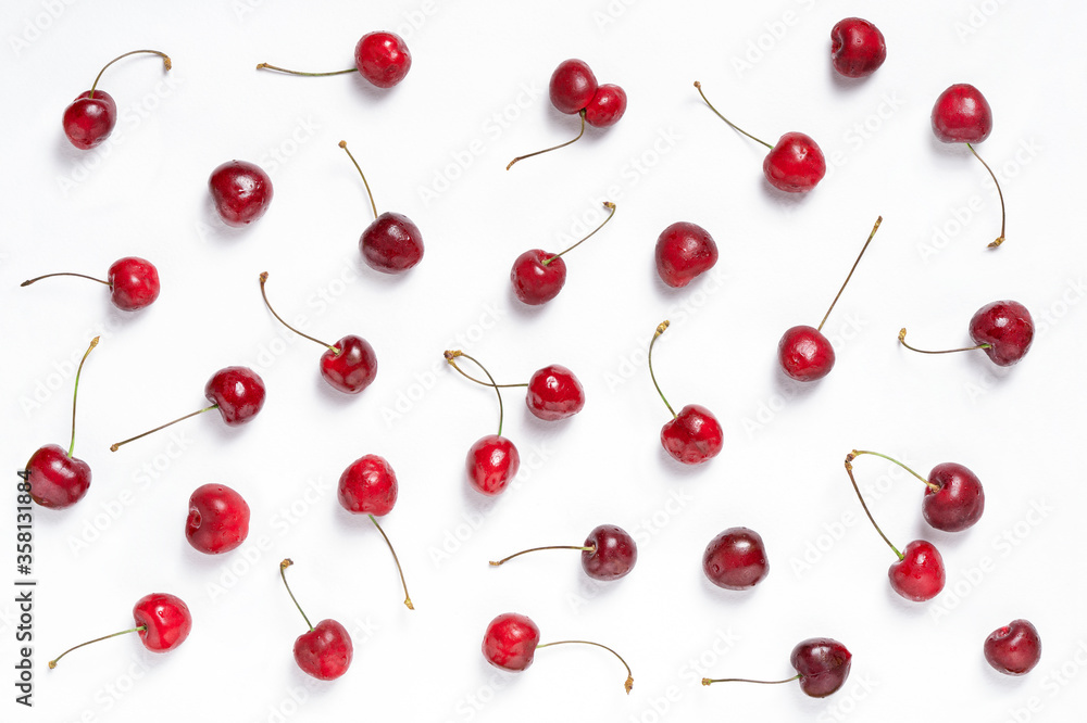 Fresh cherries pattern on white background. Ripe cherry berries, top view. Fresh cherries pattern on white background. Ripe cherry berries, top view.