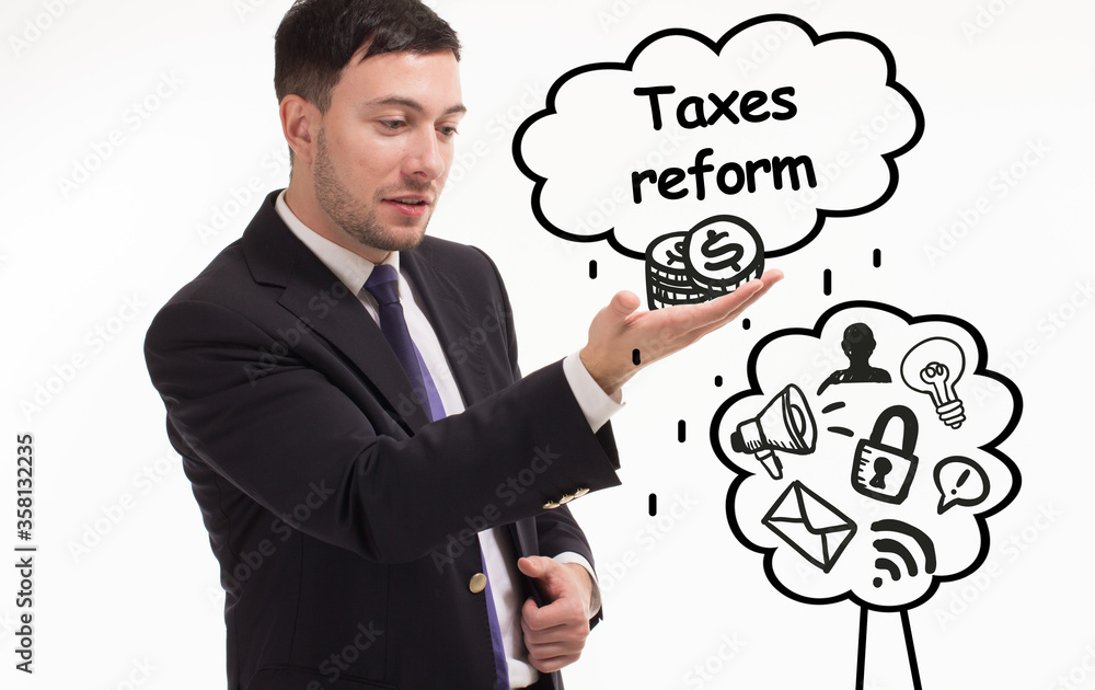 Business, technology, internet and network concept. Young businessman thinks over the steps for successful growth: Taxes reform Business, technology, internet and network concept. Young businessman thinks over the steps for successful growth: Taxes reform