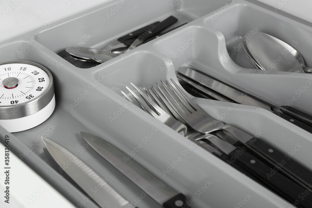 Box with different utensils, closeup. Order in kitchen Box with different utensils, closeup. Order in kitchen
