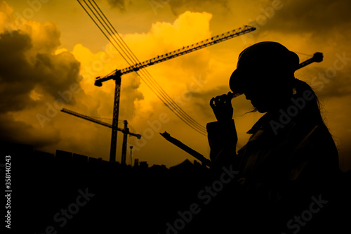 Asian engineer working at site of a large building project,Thailand people,Work overtime at construction site