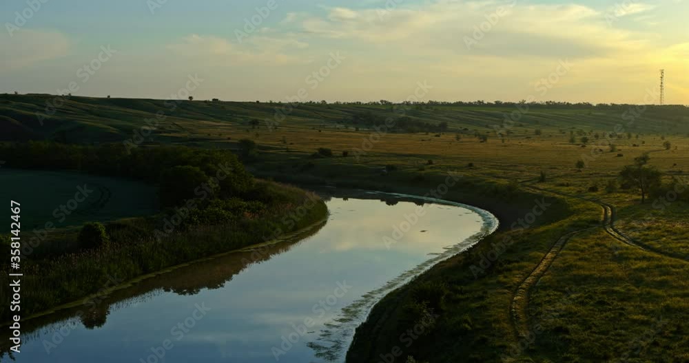 River and green meadow at sunset, aerial view, beautiful landscape River and green meadow at sunset, aerial view, beautiful landscape