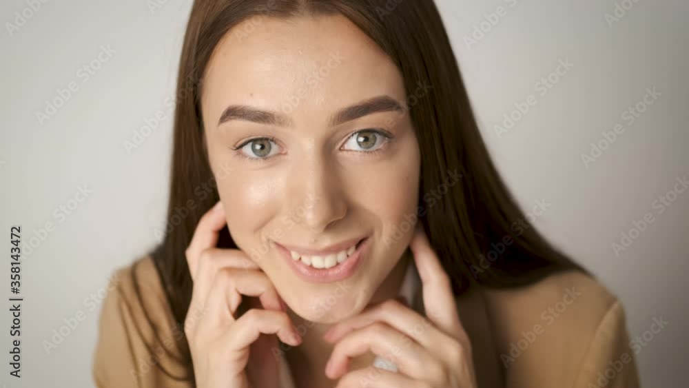 Smiling business woman sitting at the desk of her office and coming up with business ideas Smiling business woman sitting at the desk of her office and coming up with business ideas