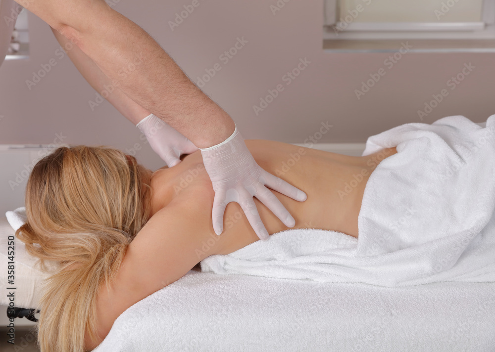 Fototapeta premium Chiropractic and Physiotherapy During the COVID-19 Pandemic, following Safety protocols