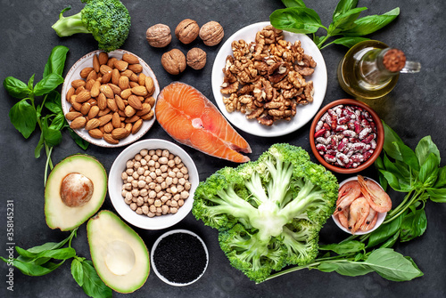 Wallpaper Mural Omega 3 food sources on stone background. Foods high in fatty acids, including seafood, vegetables, nuts and seeds. Torontodigital.ca