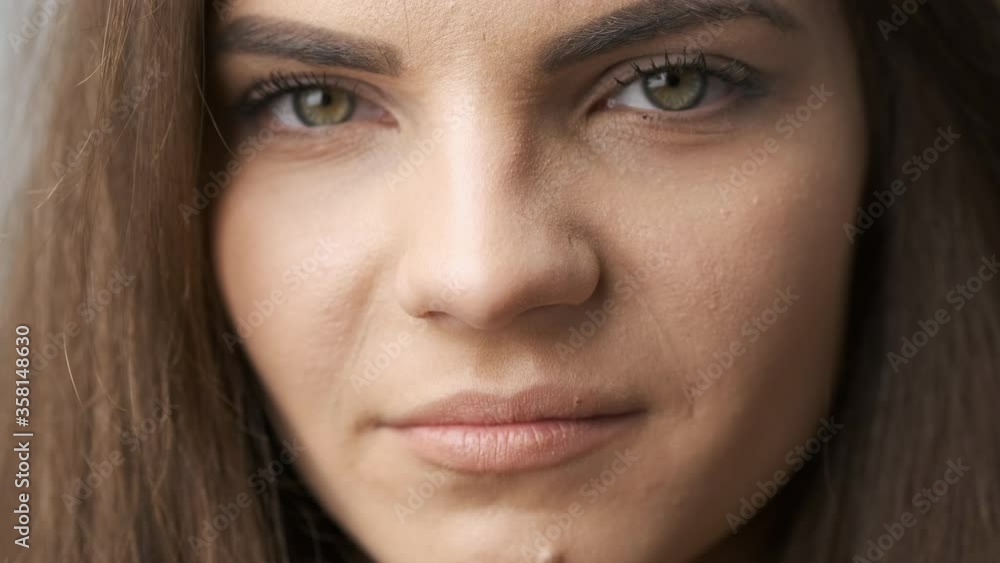 Beautiful girl of Caucasian appearance with long black hair posing for the camera in the studio. A beautiful look in his eyes Beautiful girl of Caucasian appearance with long black hair posing for the camera in the studio. A beautiful look in his eyes
