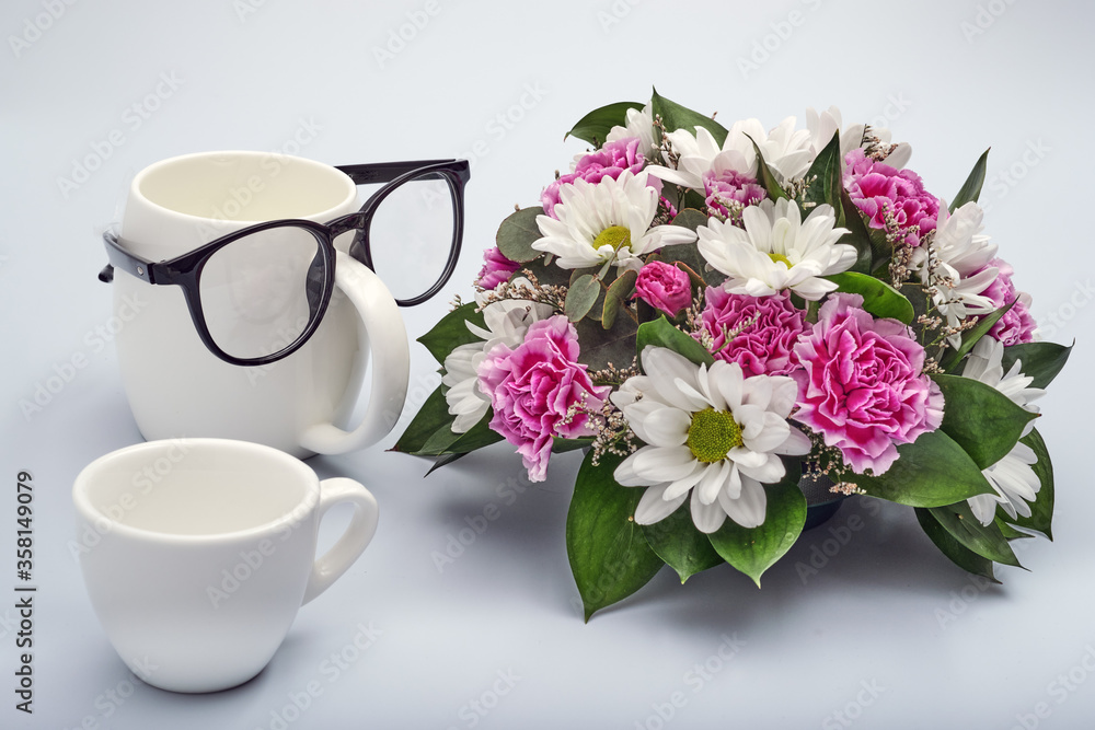 Celebration background for happy father's day. Creative breakfast with funny face made from a cups of coffee and glasses. Flowers for dad. Celebration background for happy father's day. Creative breakfast with funny face made from a cups of coffee and glasses. Flowers for dad.