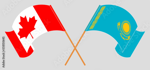 Crossed and waving flags of Kazakhstan and Canada